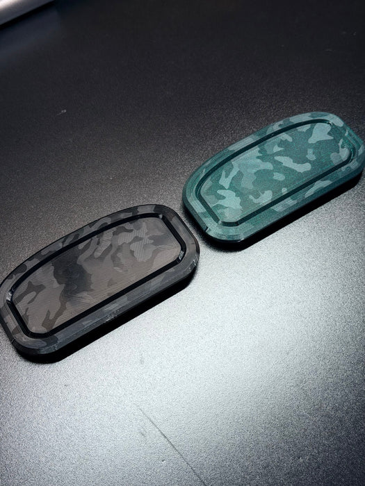LunaticsCo MK1 Motorsport 3D-printed TPU flywheel inspection hole covers in black and green camouflage patterns.