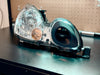 LunaticsCo MK1 Motorsport headlight air ram installed in a Lexus GS headlight housing with a black intake duct.