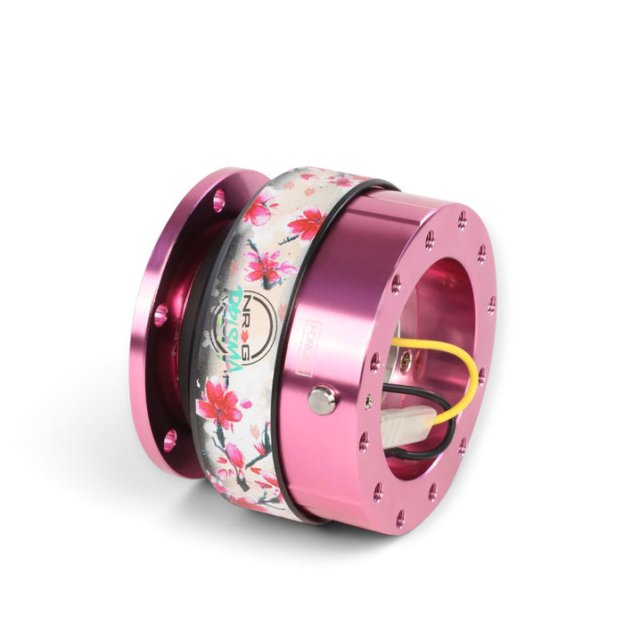 Lunaticsco NRG Gen 2.0 quick release steering wheel hub in pink aluminum with a floral Sakura pattern ring