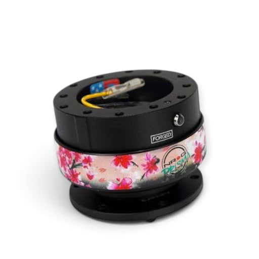 Lunaticsco NRG Gen 2.0 quick release with black aluminum body and sakura floral pattern ring for steering wheels