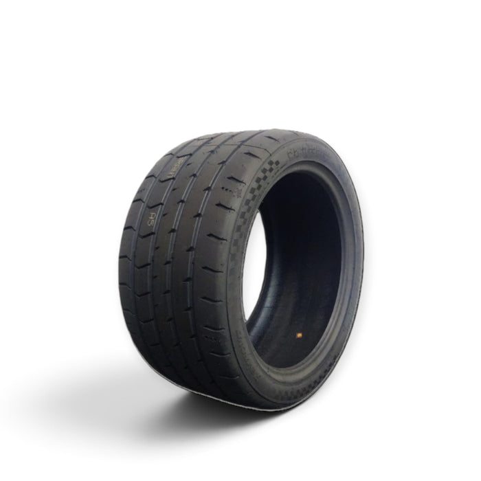 Lunaticsco Zeknova Grantourer competition drift and track tire featuring an asymmetric tread pattern and black rubber.