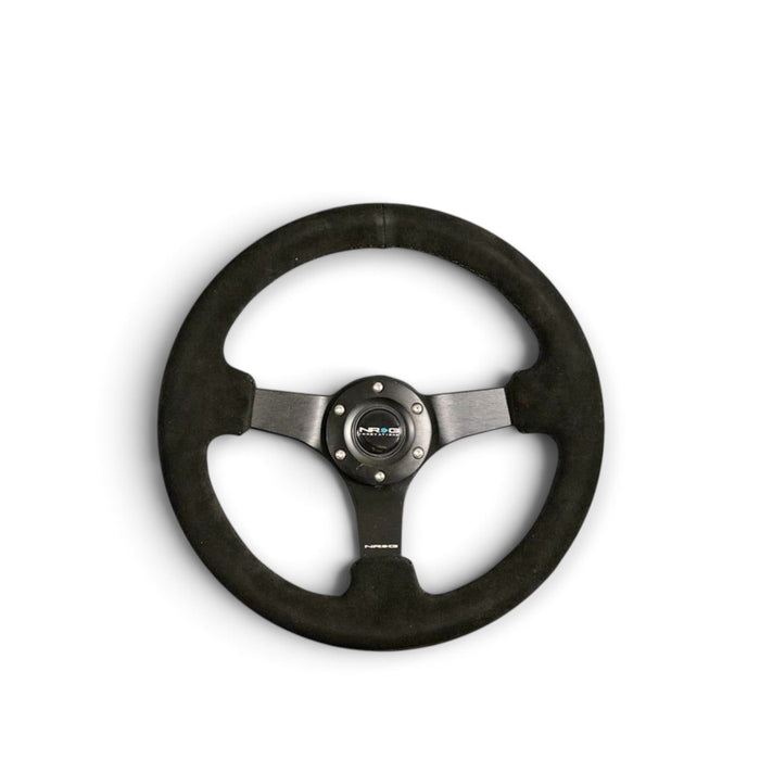 NRG Reinforced Steering Wheel (330mm / 3in Deep) Blk Suede w/Criss Cross Stitch w/Blk 3-Spoke Center - Lunaticsco